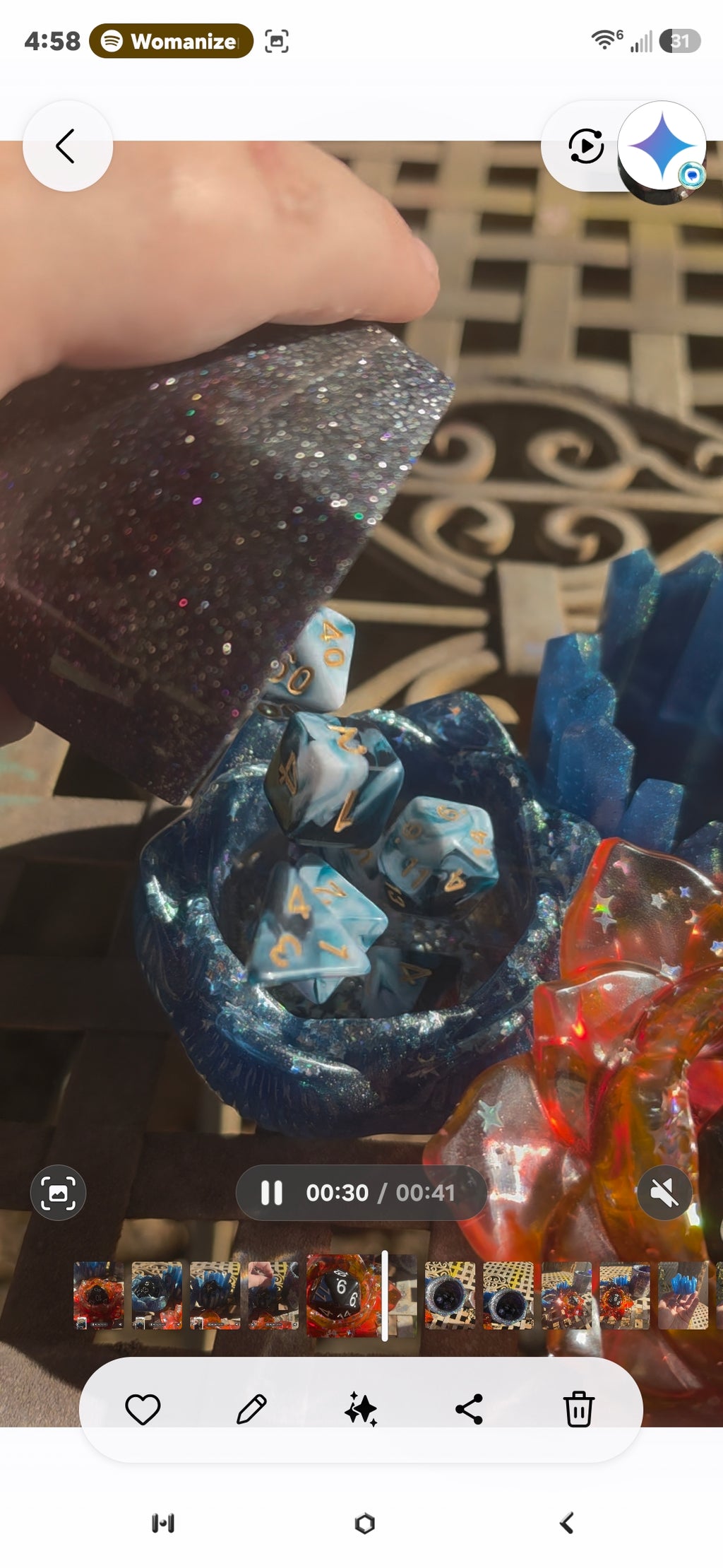 Video still showing midnight galaxy resin dice cup being used to roll dice into blue resin lotus dice throne
