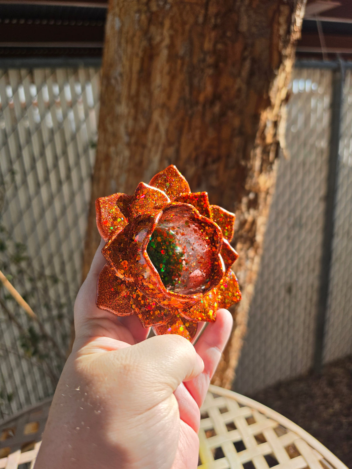 Bottom view of autumn lotus resin throne showing green and gold glitter detail on base