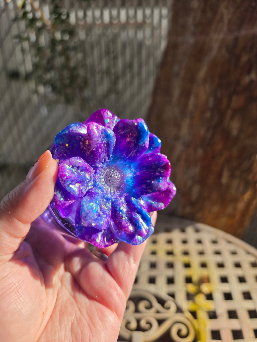 Back view of handcrafted purple galaxy resin storage jar in sunlight