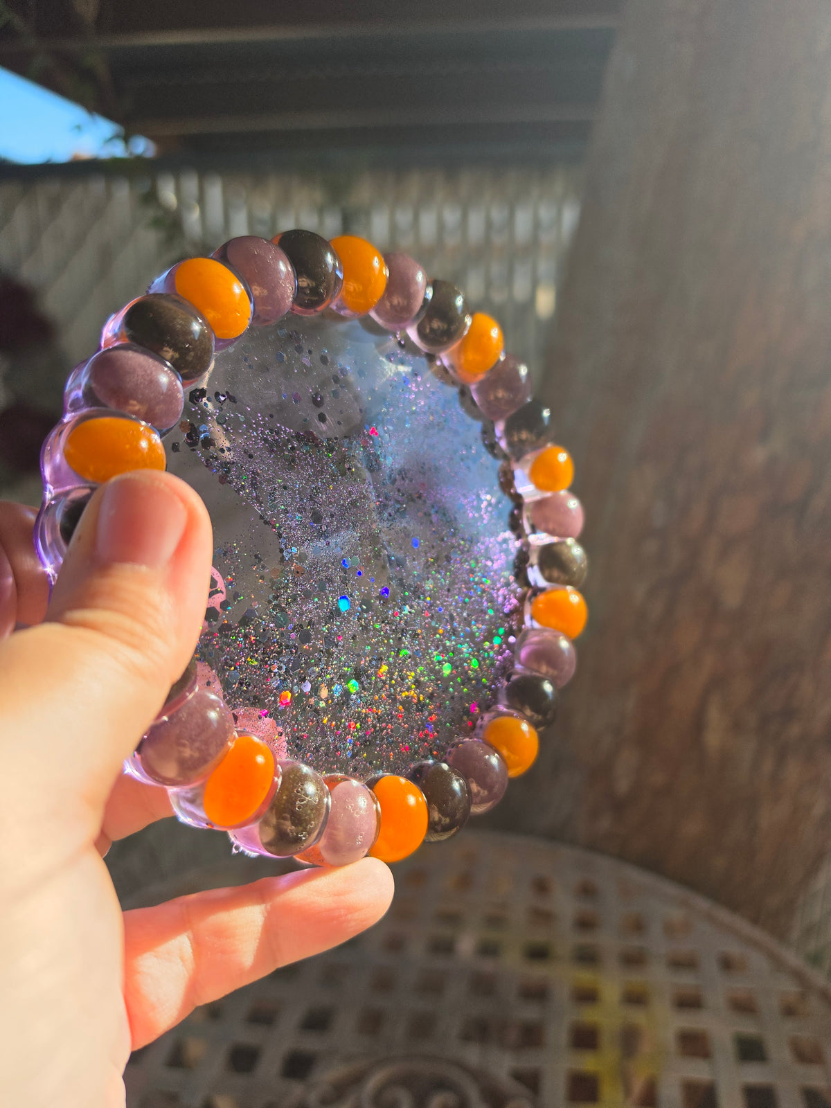 Close view of Halloween jelly bean rim and glitter resin center